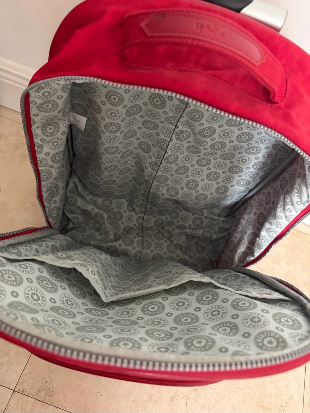 Kipling Bright Red Rolling Backpack with Monkey Charm